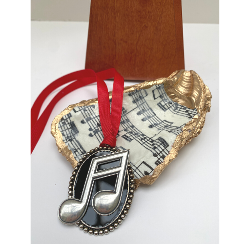 Gifts for music teachers include Christmas ornaments, art, jewelry, and home decor.