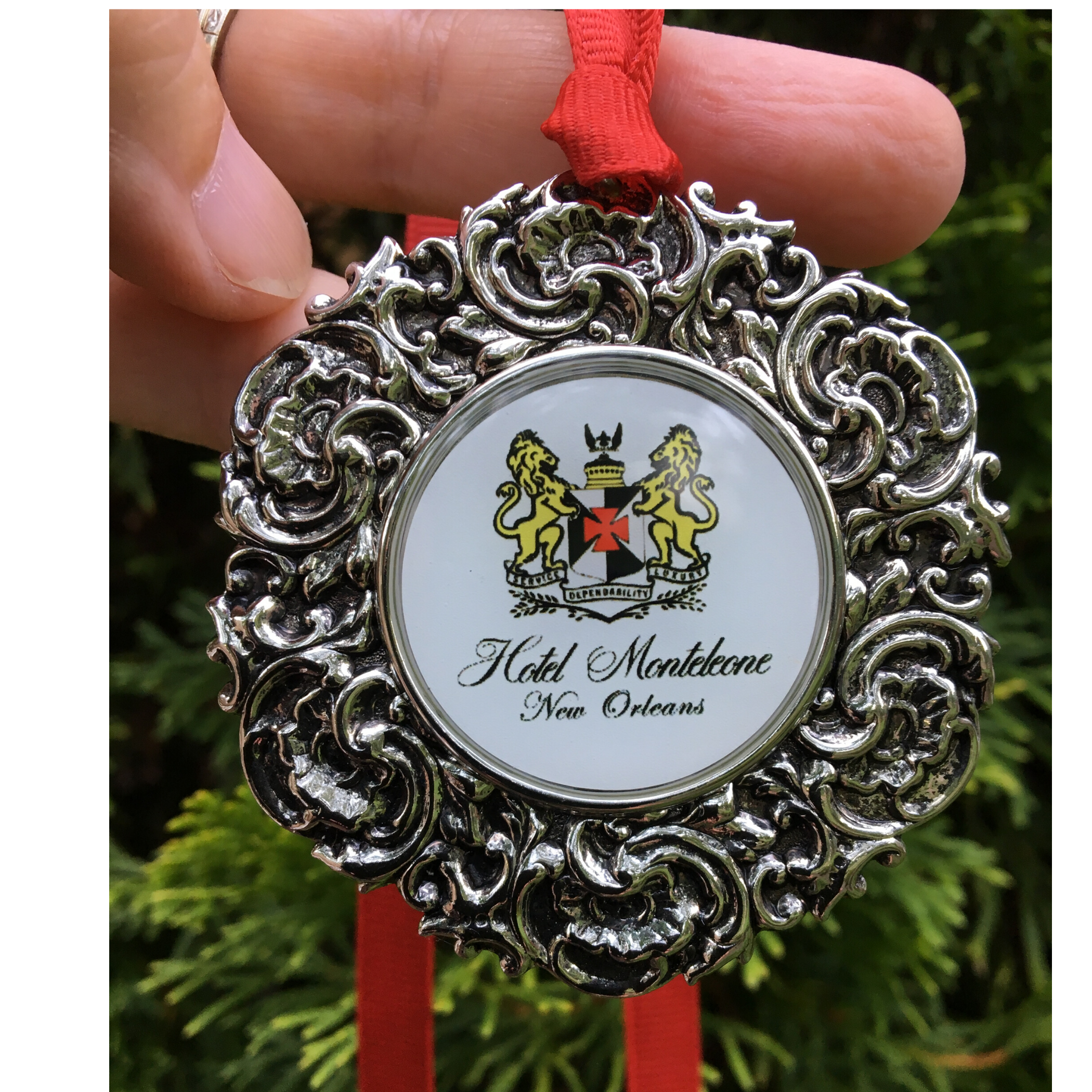 The Silver Christmas Ornament with Logo in the center by Classic Legacy features a circular vintage silver piece that is embellished wit your logo, art of photograph.