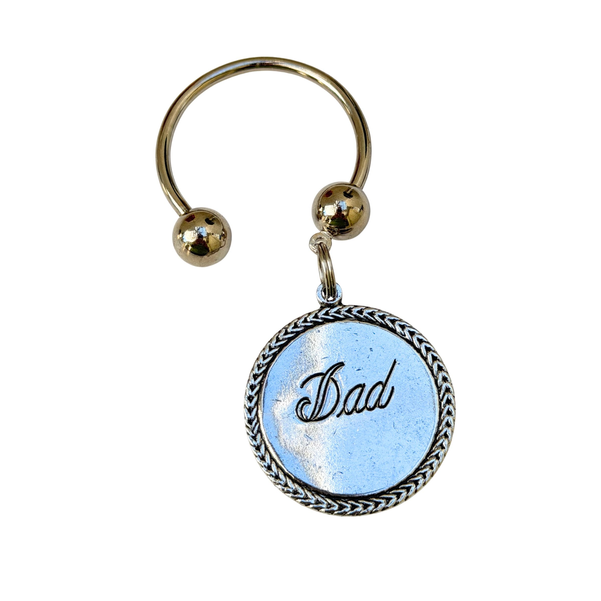 Keychain with 'Dad' on a blue background