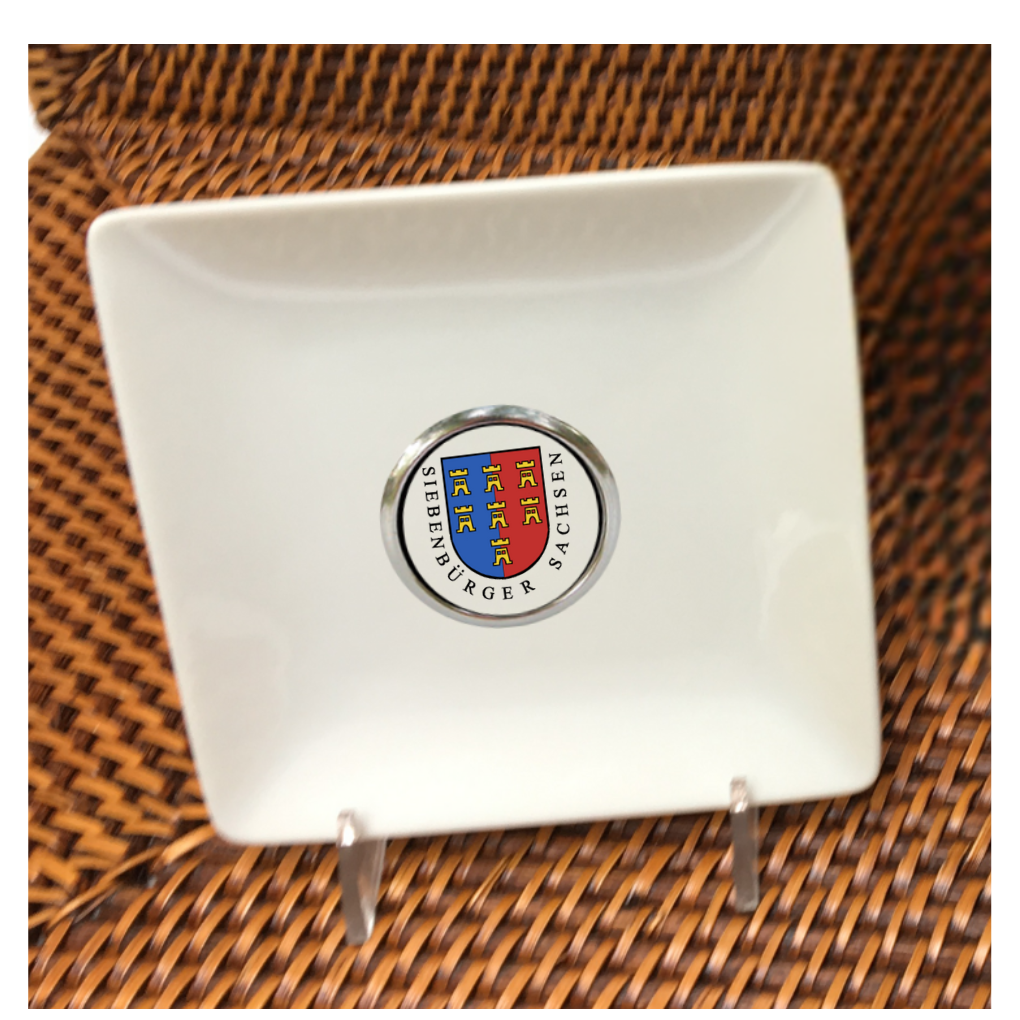 Our custom trinket trays are personalized with a round silver setting that features your logo, art, or photo. MINIMUM ORDER QUANTITIES APPLY. These trinket dishes are 4.5" square and can be used to hold earrings, necklaces, bracelets, and also golf tees and coins! Stand one on an easel for instant art for your bookshelf or desk.