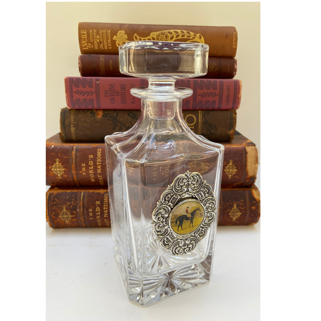 Glass decanter with silver medallion and vintage race horse