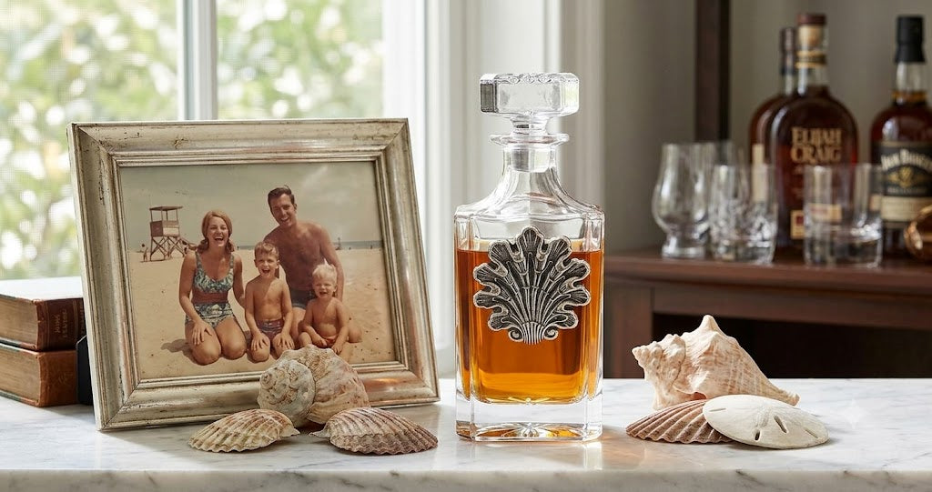 Decanter with Vintage sea shell medallion Gift for beach lover. Shown in home bar of bourbon lover.