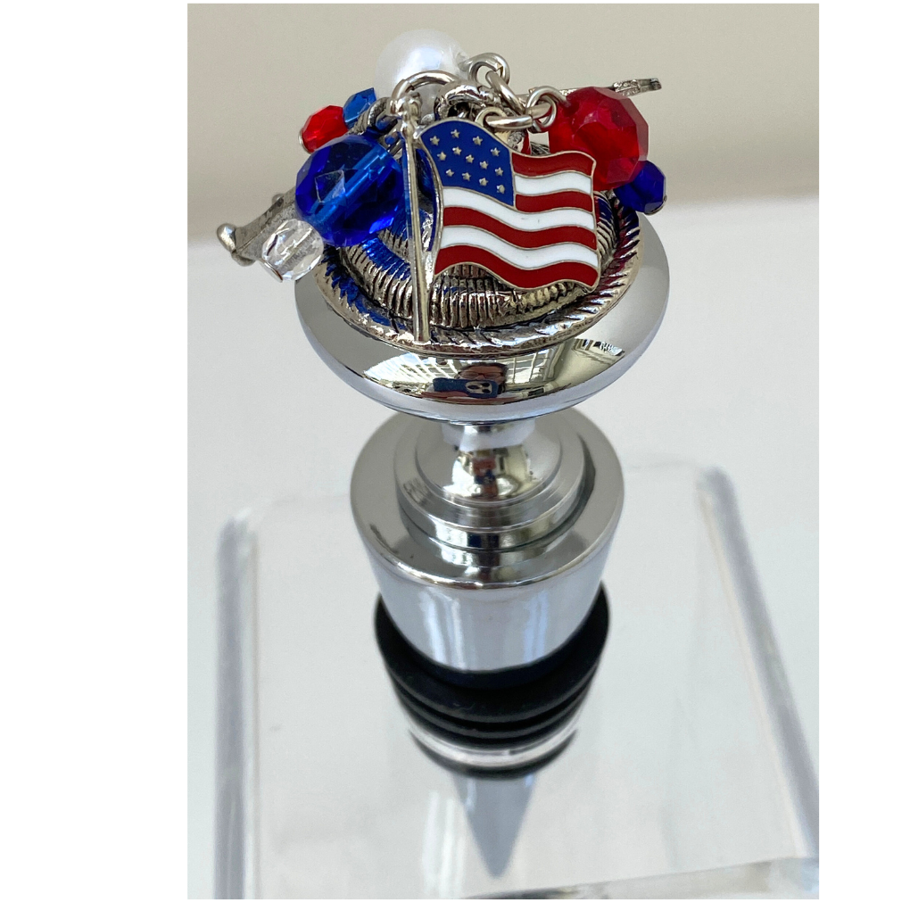 Wine Bottle Stopper with Navy theme. USA Flag charm shown and is displayed in the clear stand.