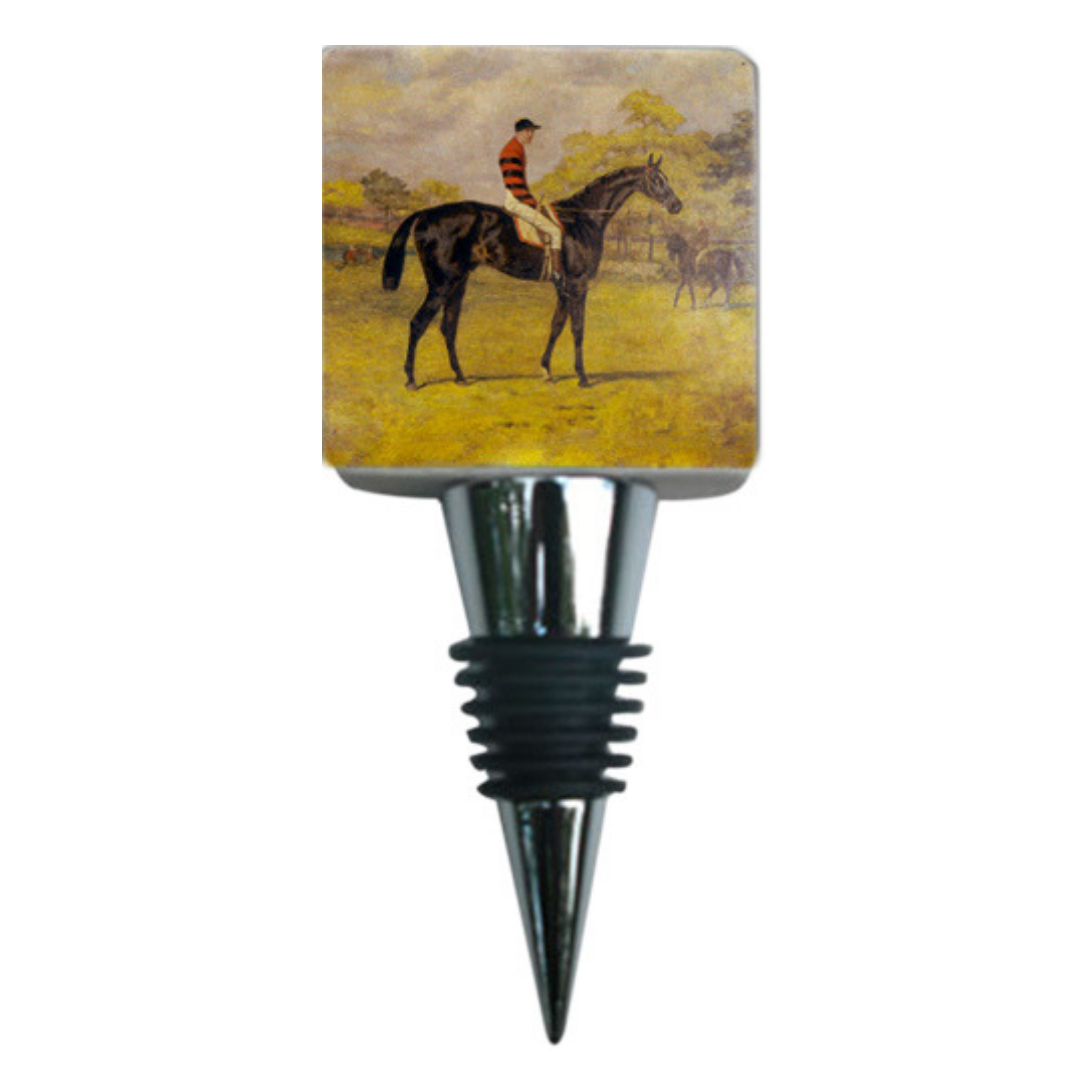 A marble bottle stopper with a vintage racehorse theme, depicting a black horse with a jockey in a red and black striped shirt on a yellow background.