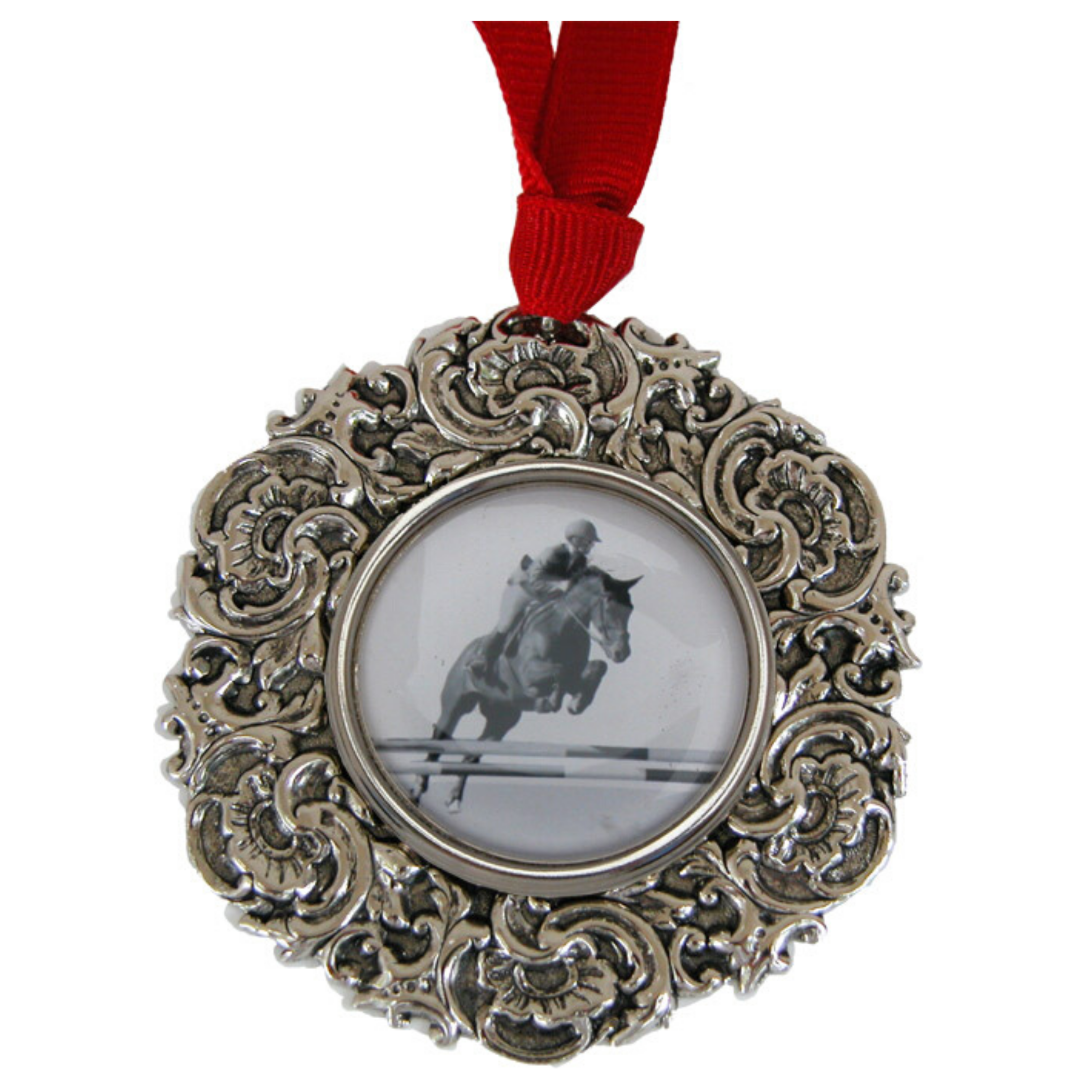 A silver Christmas ornament with an equestrian hunter jumper and rider image in the center, attached to a red ribbon for hanging.