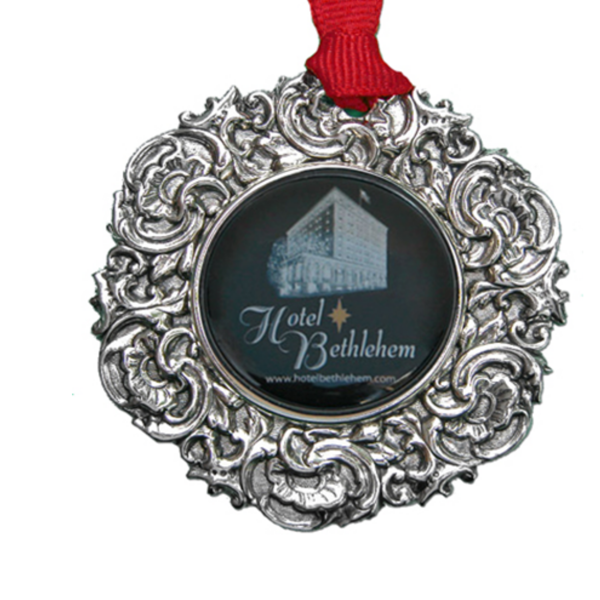 The Custom Christmas Ornament in the Classic Legacy collection is designed with a vintage inspired silver medallion. In the center is the art of logo. This is a personalized gift for corporations, hotels, and museums. Shown is the Hotel Bethlehem Christmas Ornament.