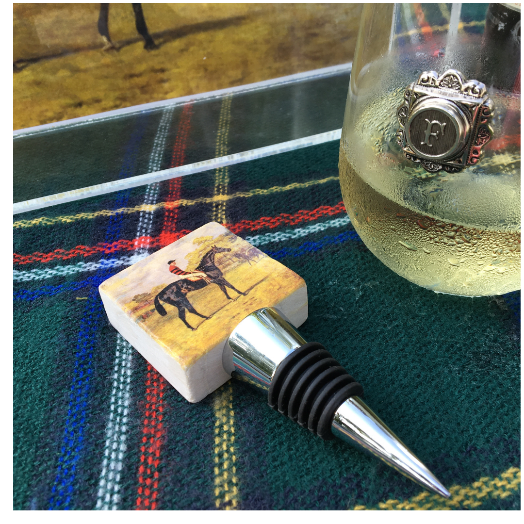 Marble Wine Bottle Stopper for a Racehorse Fan on a table next to a wine glass