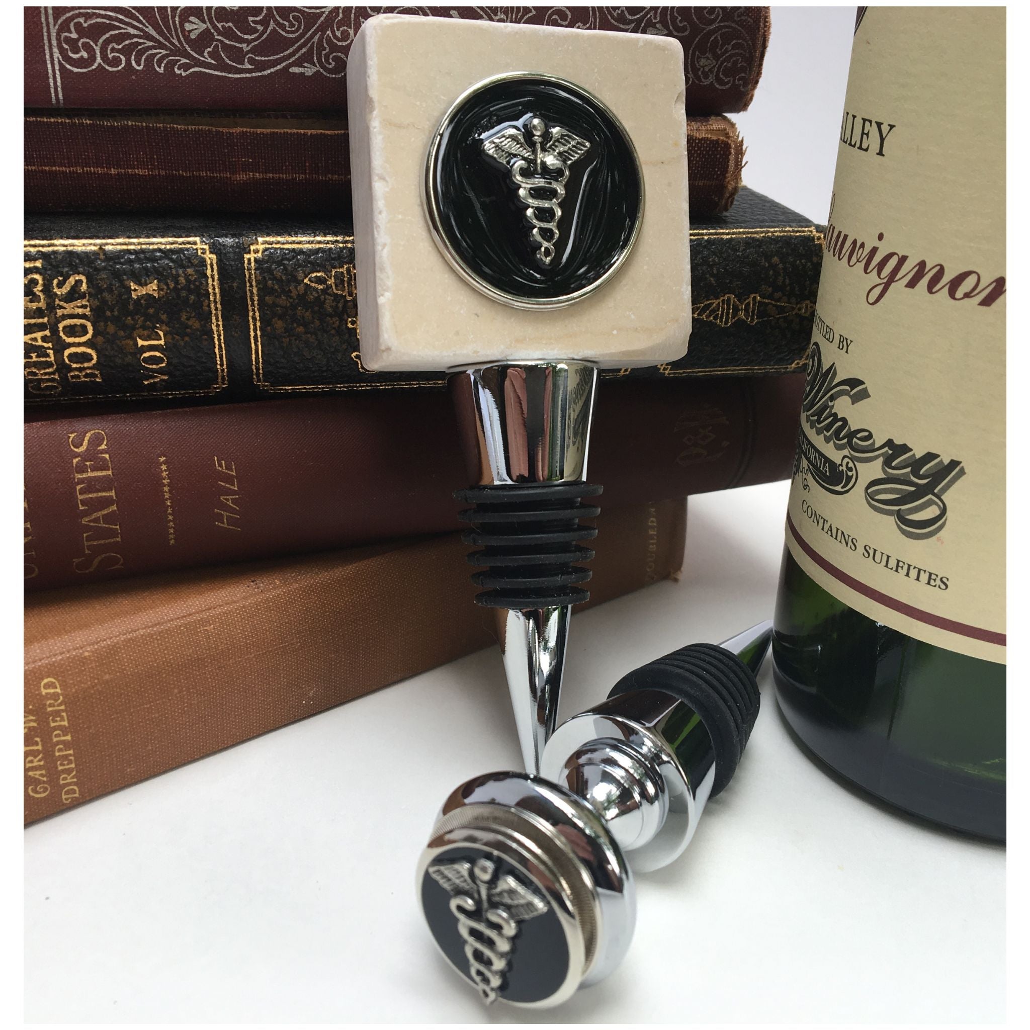 Medical School Graduation gifts include wine bottle stoppers, desk accessories, decanters, and home decor.