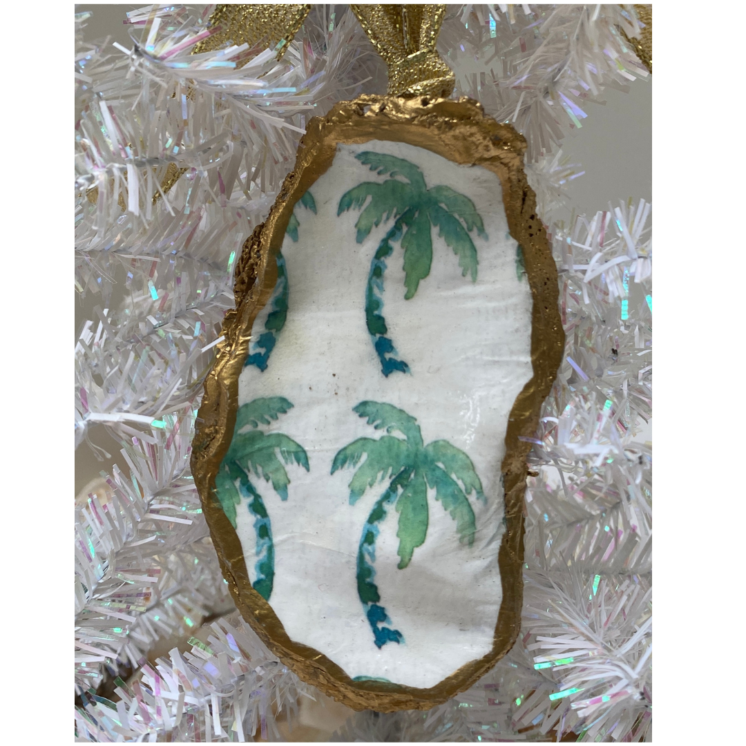 Beach holiday Christmas ornament featuring green palm trees