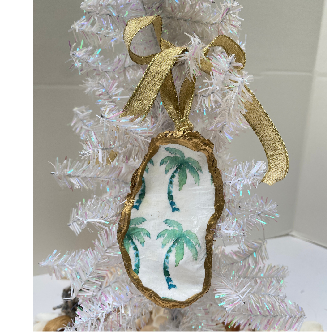 Beach holiday Christmas ornament featuring green palm trees