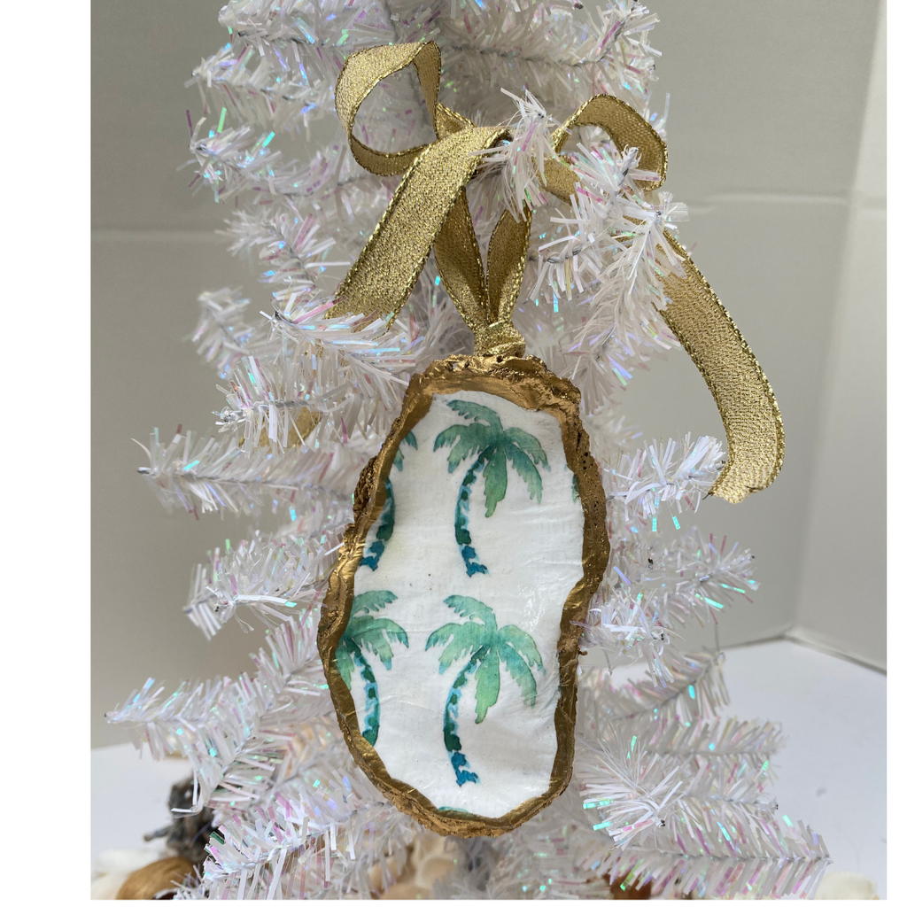 Beach holiday Christmas ornament featuring green palm trees