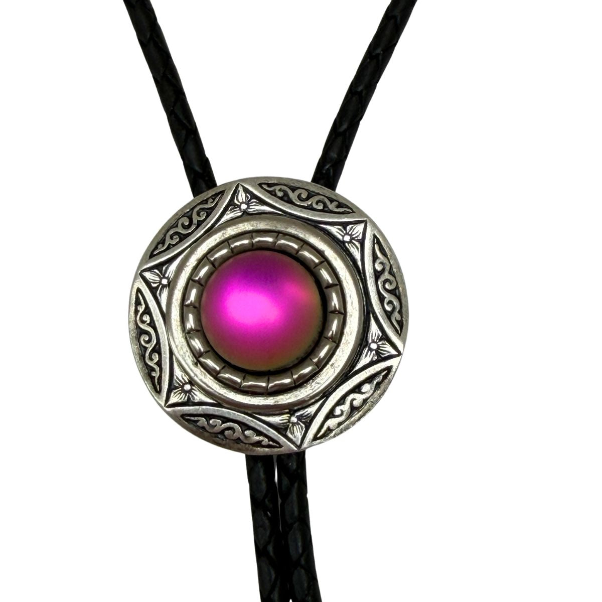 The Classic Legacy bolo tie is perfect to wear for a Western-themed wedding or event.  This style features a round silver setting and, in the center, a pink iridescent stone.