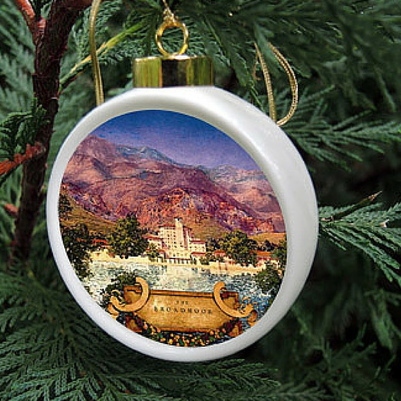 The Custom China Christmas ornament is a porcelain drum shape ornament featuring your logo or art.  Each is hand-crafted and comes in a gift box with a clear lid.  This design was created for the Broadmoor Hotel.