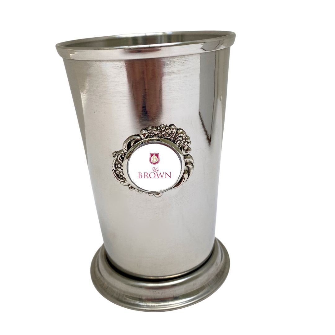 This stainless steel cup mint  julep  features YOUR Logo.  It holds 12 ounces.  It is the perfect corporate gift to celebrate the Kentucky Derby.   This photo shows the Brown Hotel design.

Holds 12 ounces

3" Diameter x 4-3/8" Height

Polished Stainless Steel

Features a vintage-inspired silver medallion and YOUR company logo.

Custom Guidelines apply
Allow 3 weeks for custom orders