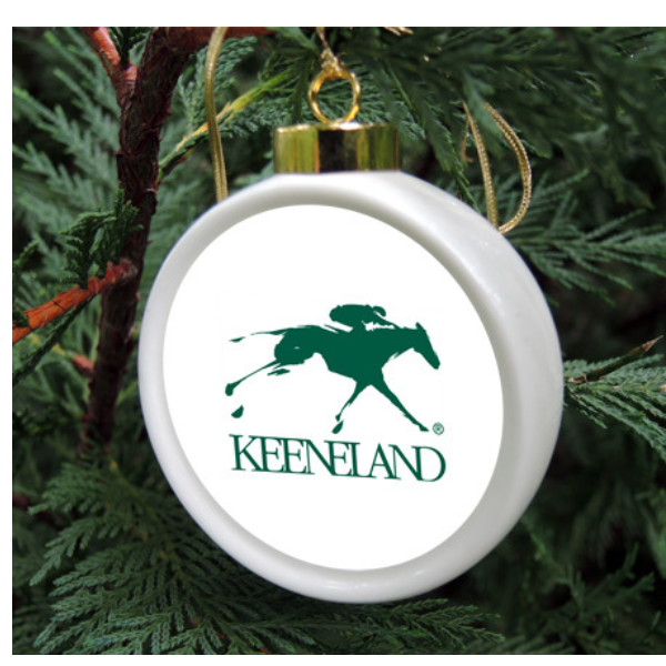 Custom porcelain Christmas ornament featuring the Keeneland horse racing logo.
