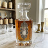 Decanter with Fancy Vintage Silver Medallion Gift for Lover of Bourbon and Antiques Shown on white marble counter