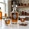 Our Classic Legacy dressage decanter set includes a large decanter embellished with a large oval silver medallion with an art image of a decanter horse and rider.   The two bourbon glasses are embellished with silver medallions as well.  Each is handcrafted.