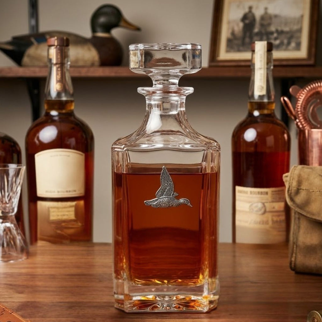 This duck decanter features a large silver duck medallion on the crystal clear decanter.   It is a great gift for a duck hunter or duck lover and bourbon fan.  