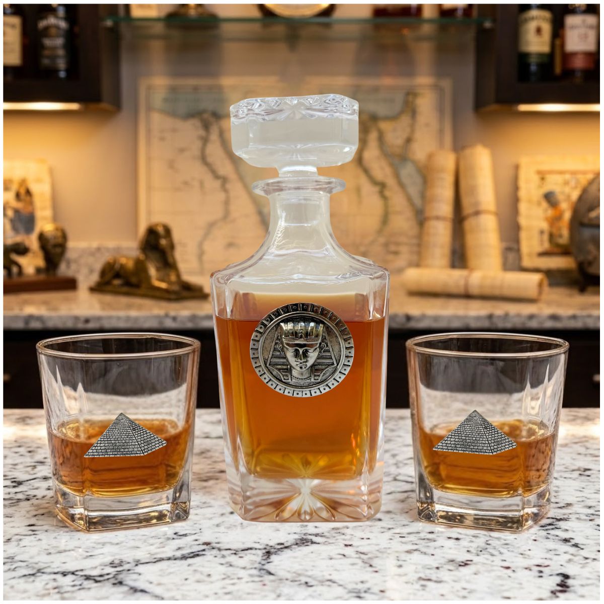 Decanter set with Egyptian theme featuring bourbon glasses with silver pyramids and the decanter featuring a Egyptian God.