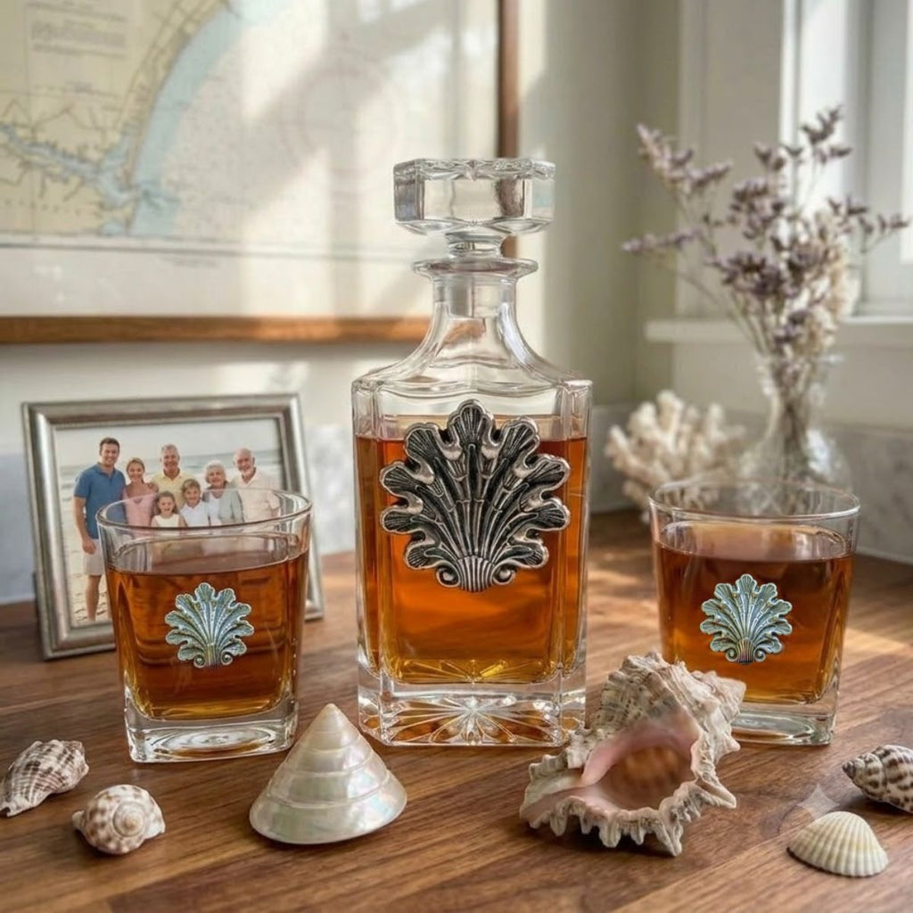 Our fancy shell decanter set features a large decanter and two bourbon glasses.  Each is embellished with vintage inspired seashells.