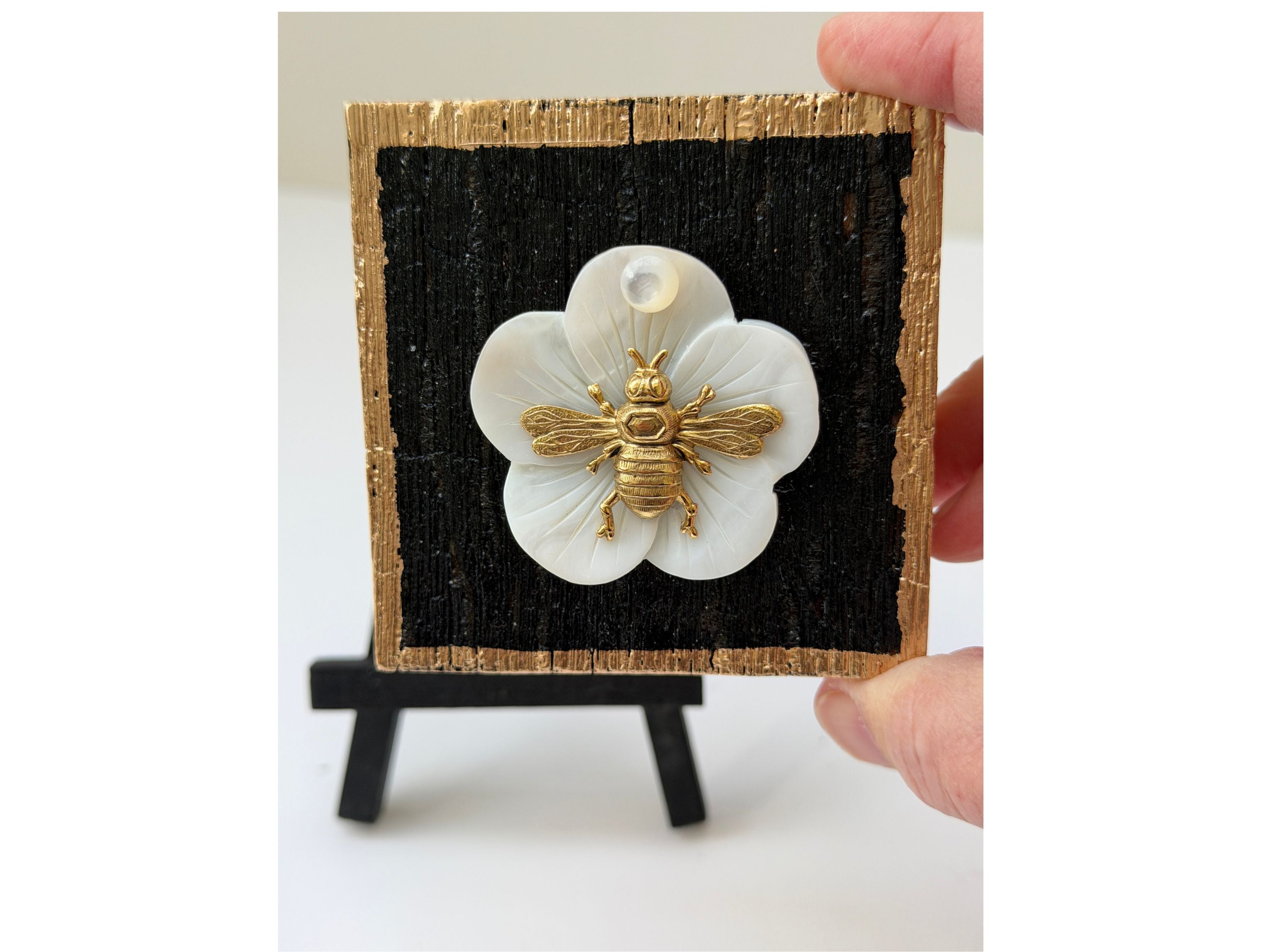 Wooden art with mother-of-pearl and a gold bee.  This art is hand-crafted from bourbon barrel wood. Great gift for Museum Bee lovers.