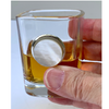 Holding shot glass with silver setting and Mother of Pearl