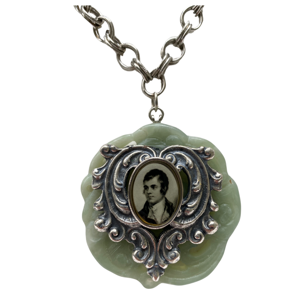 Holding vintage pocket watch necklace close up view
