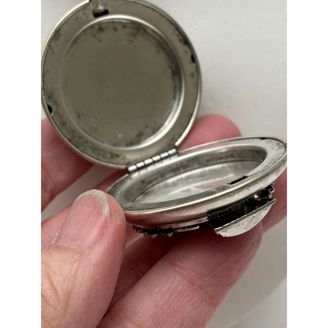 Necklace featuring silver thistle on a vintage pocket watch case