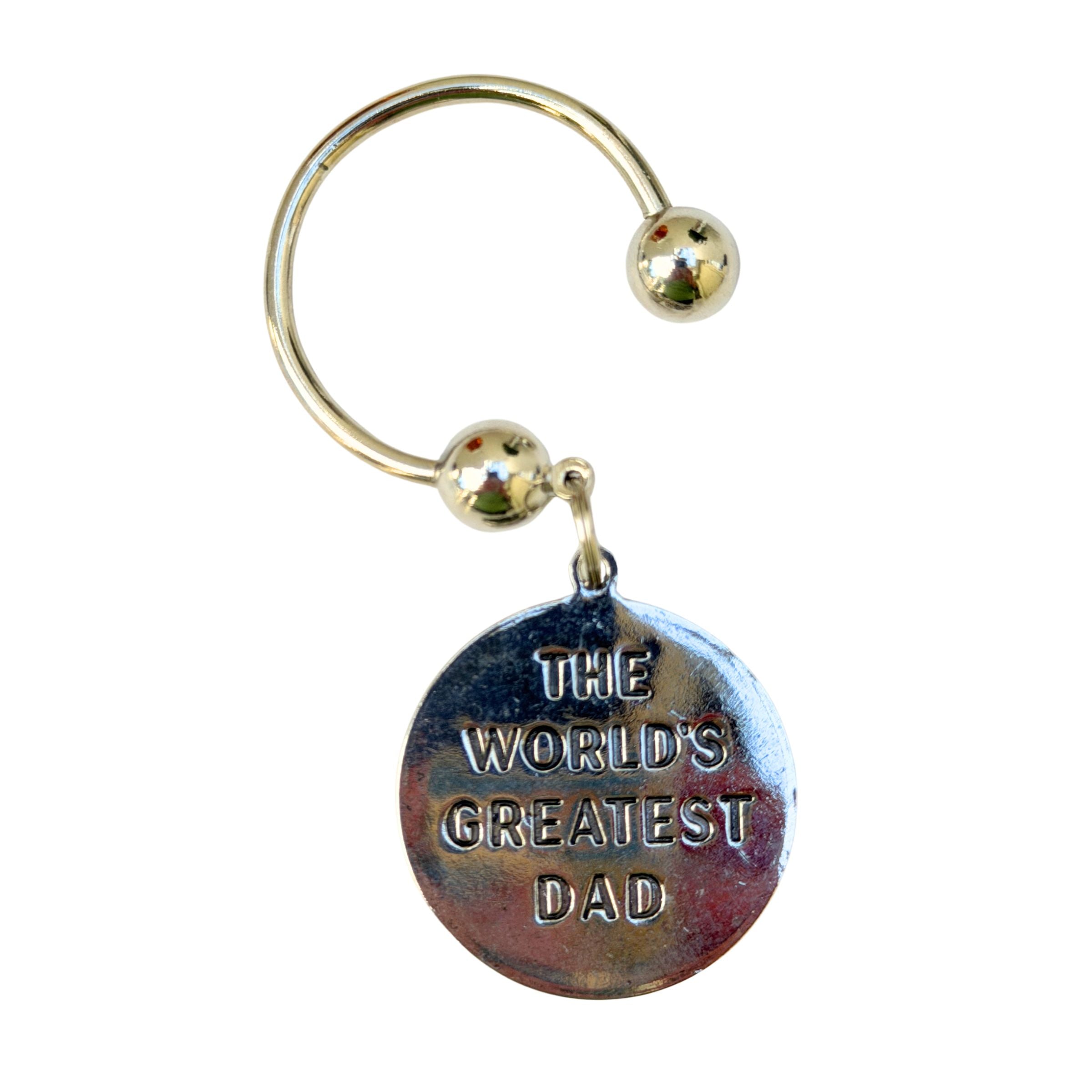 Keychain with 'The World's Greatest Dad' text on a white background
