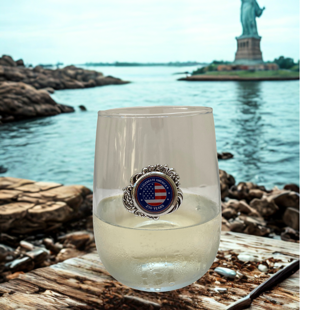 Stemless wine glass America 250 with Statue of Liberty in background