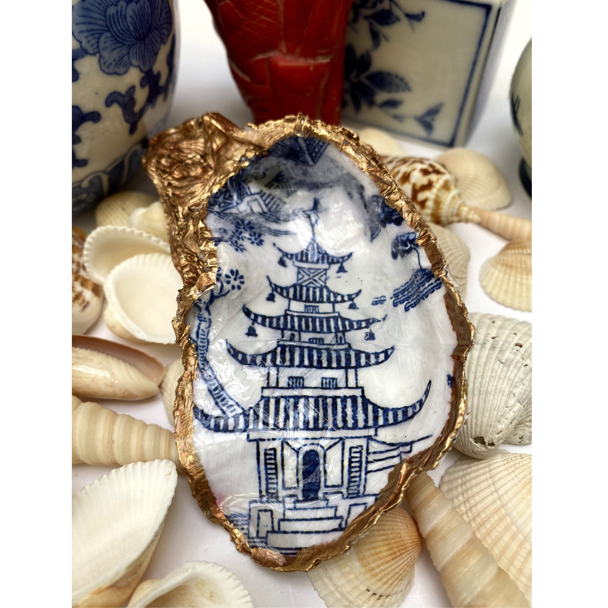 Blue and white Chinoiserie Oyster Shell art that is used for jewelry dish