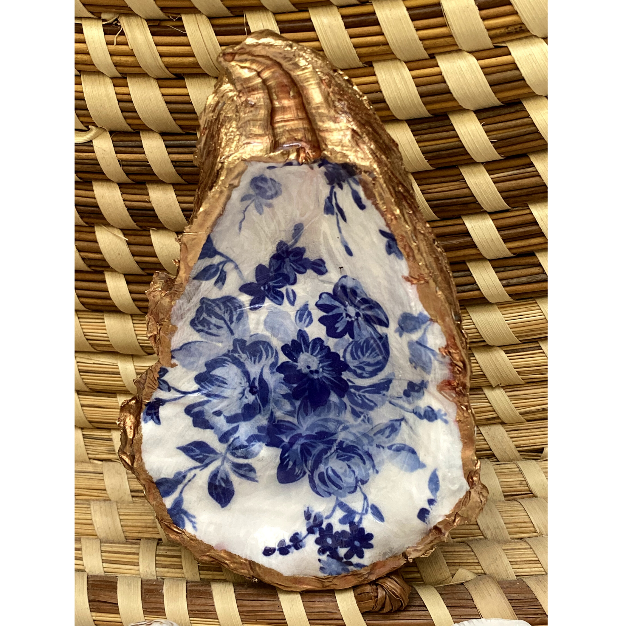 oyster shell art with blue and white flowers