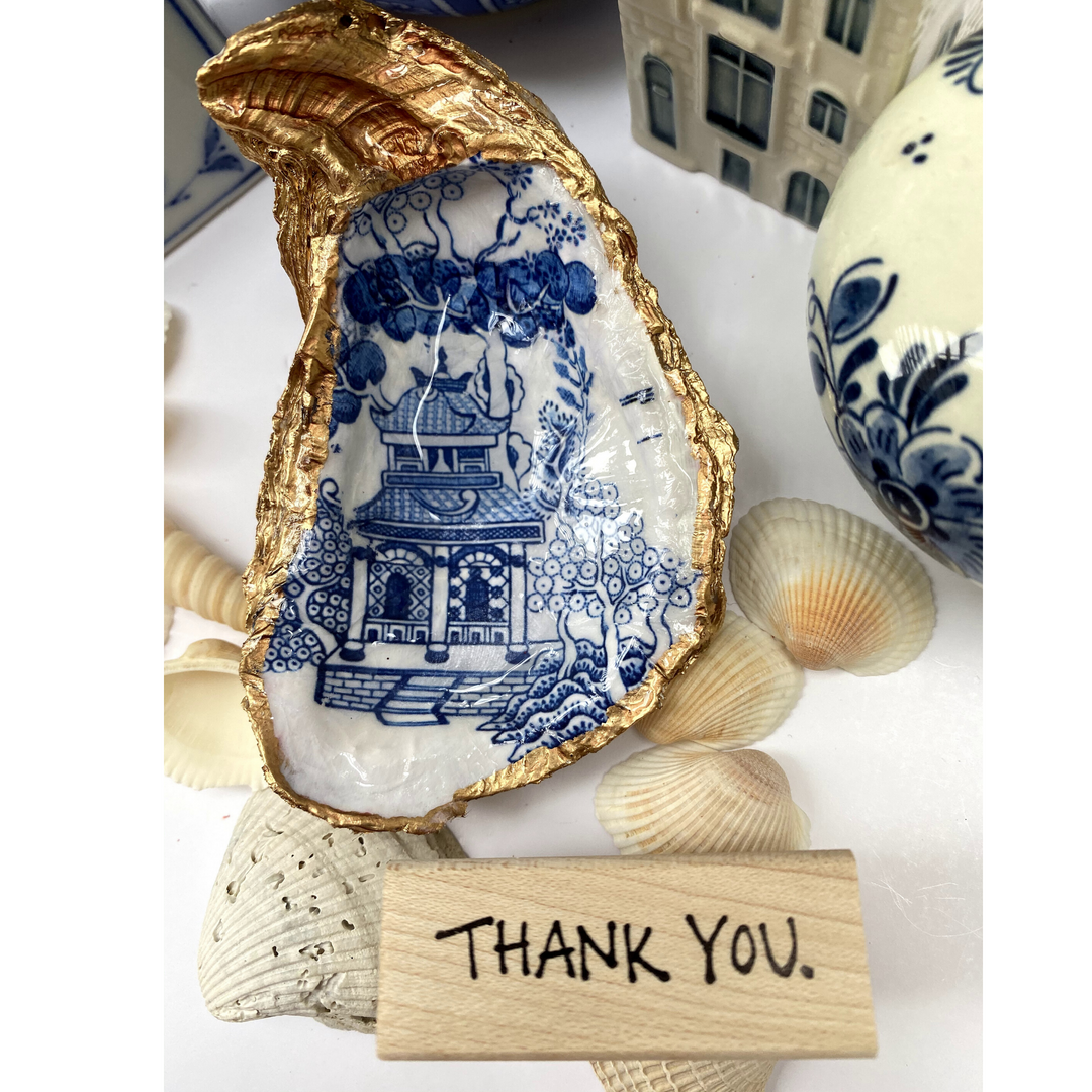 Blue and white Chinoiserie Oyster Shell art that is used for jewelry dish