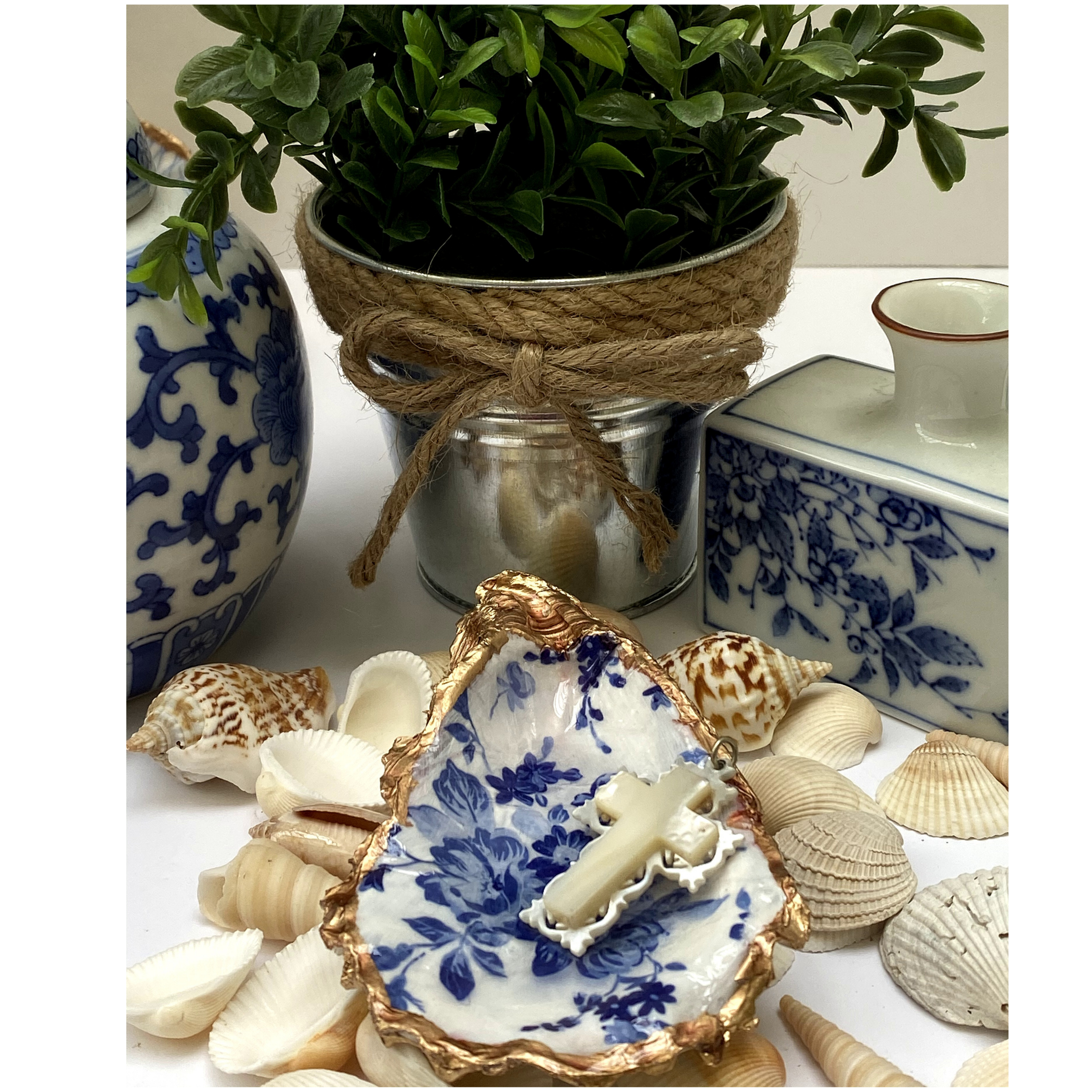 oyster shell art with blue and white flowers