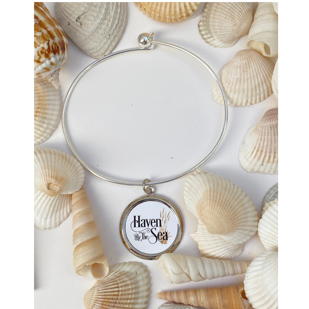 The Classic Legacy custom bracelet features a logo charm.  Each is handcrafted and a great gift for hotel gift stores.