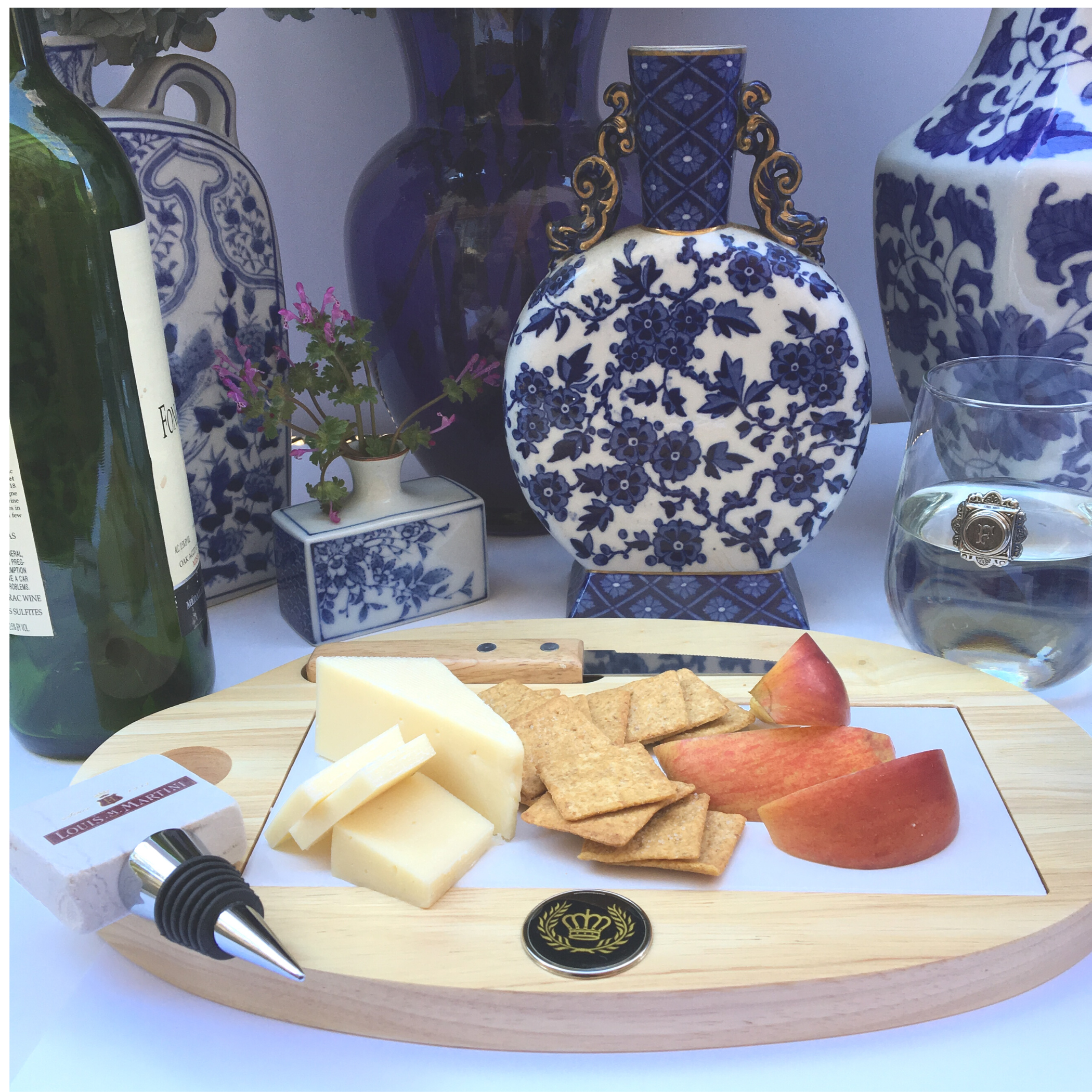 Our custom wooden and white tile cheese board is personalized with a silver medallion that features your logo, art, or photograph.   MINIMUM ORDER QUANTITIES APPLY.  This is a wonderful personalized gift.   Shown here is the design for Hotel Del Coronado.