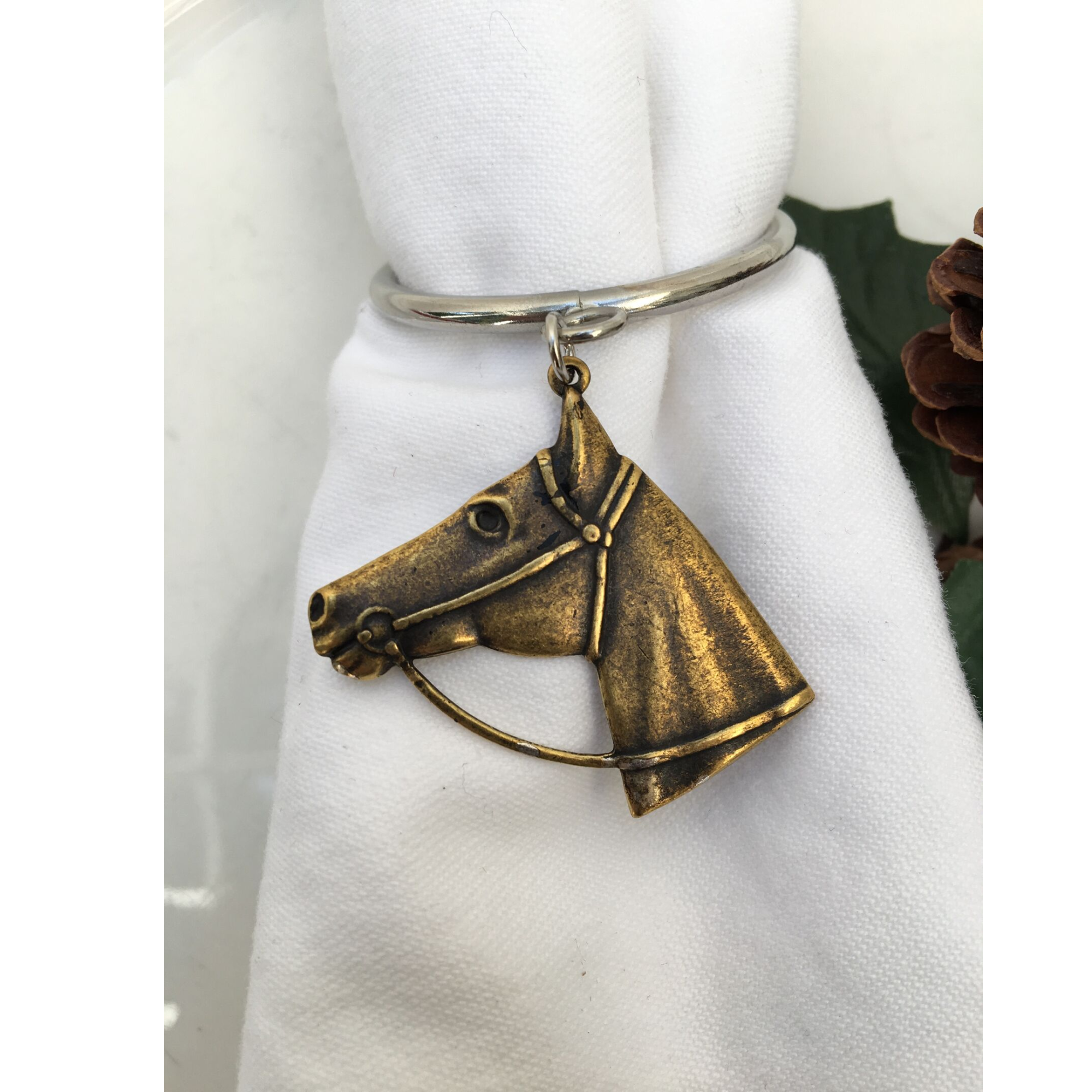 Napkin ring with antique gold horse head medallion
