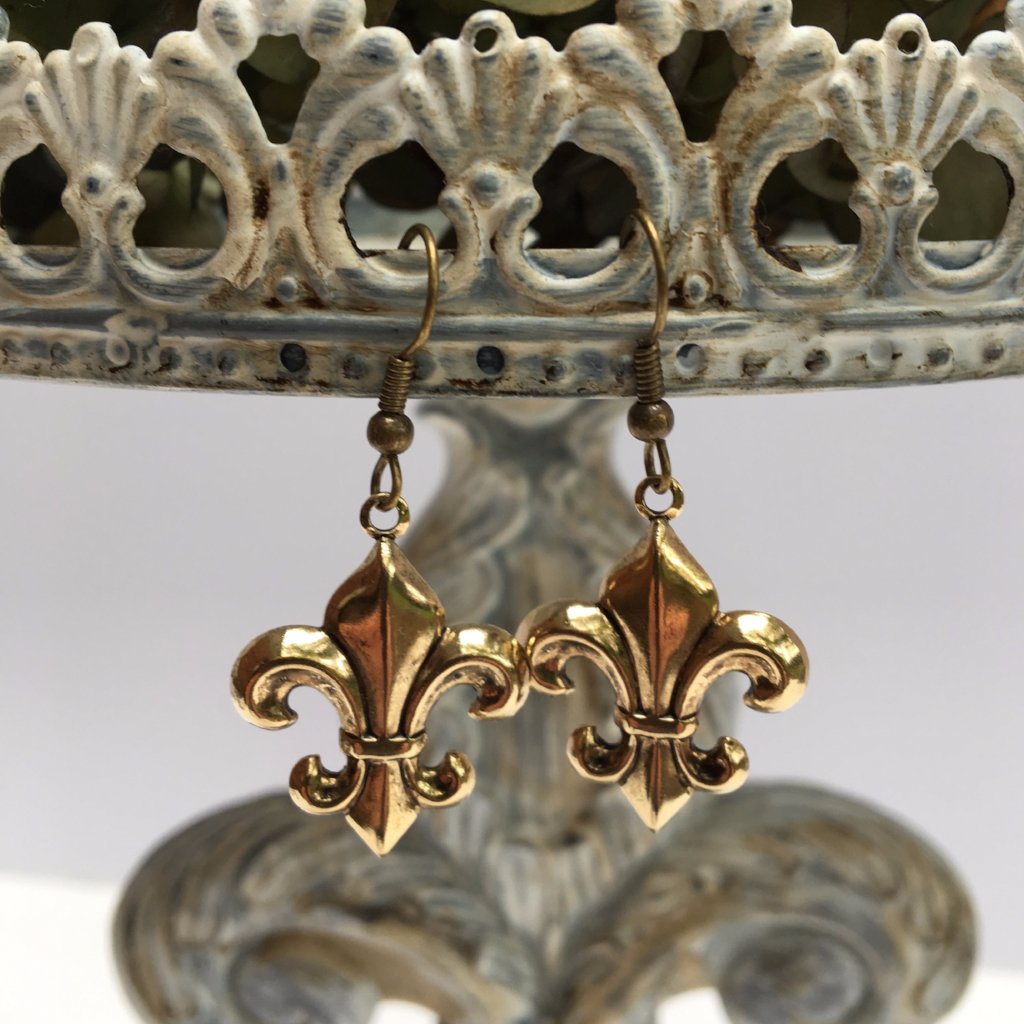 Earrings gold fleur de lis on french wires.  These earrings come carded for easy gift giving and are sure to please all fleur de lis lovers.
