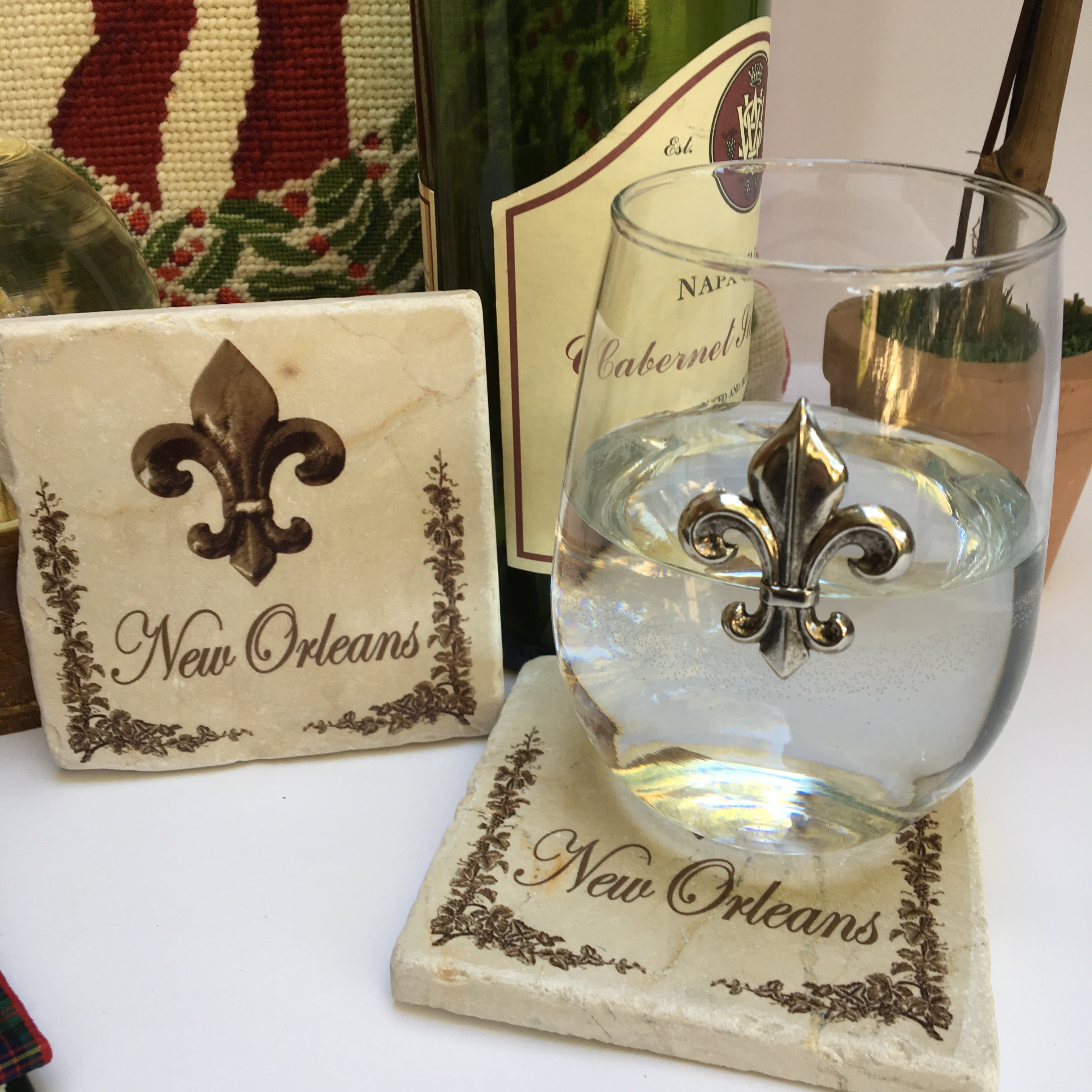 Marble coaster designed especially for the city of New Orleans.  It features an image of a silver medallion and "New Orleans".  Each marble coaster is 4" x 4" and has cork backing.  It is perfect for hot drinks and cold drinks.