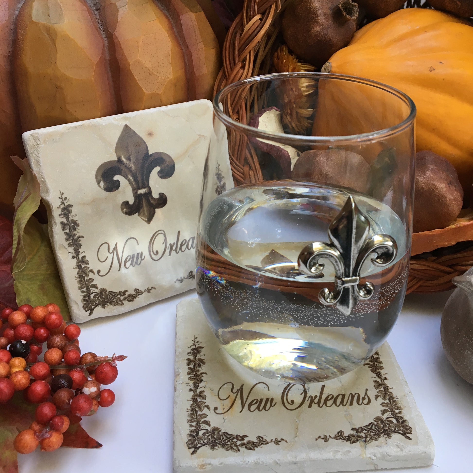 Stemless wine glass with Silver Fleur de Lis medallion. The Classic Legacy stemless wine glass holds 17 ounces of wine. Dimensions are 4.75” x 2.75”. Great table top gift for fleur de lis lovers!  
