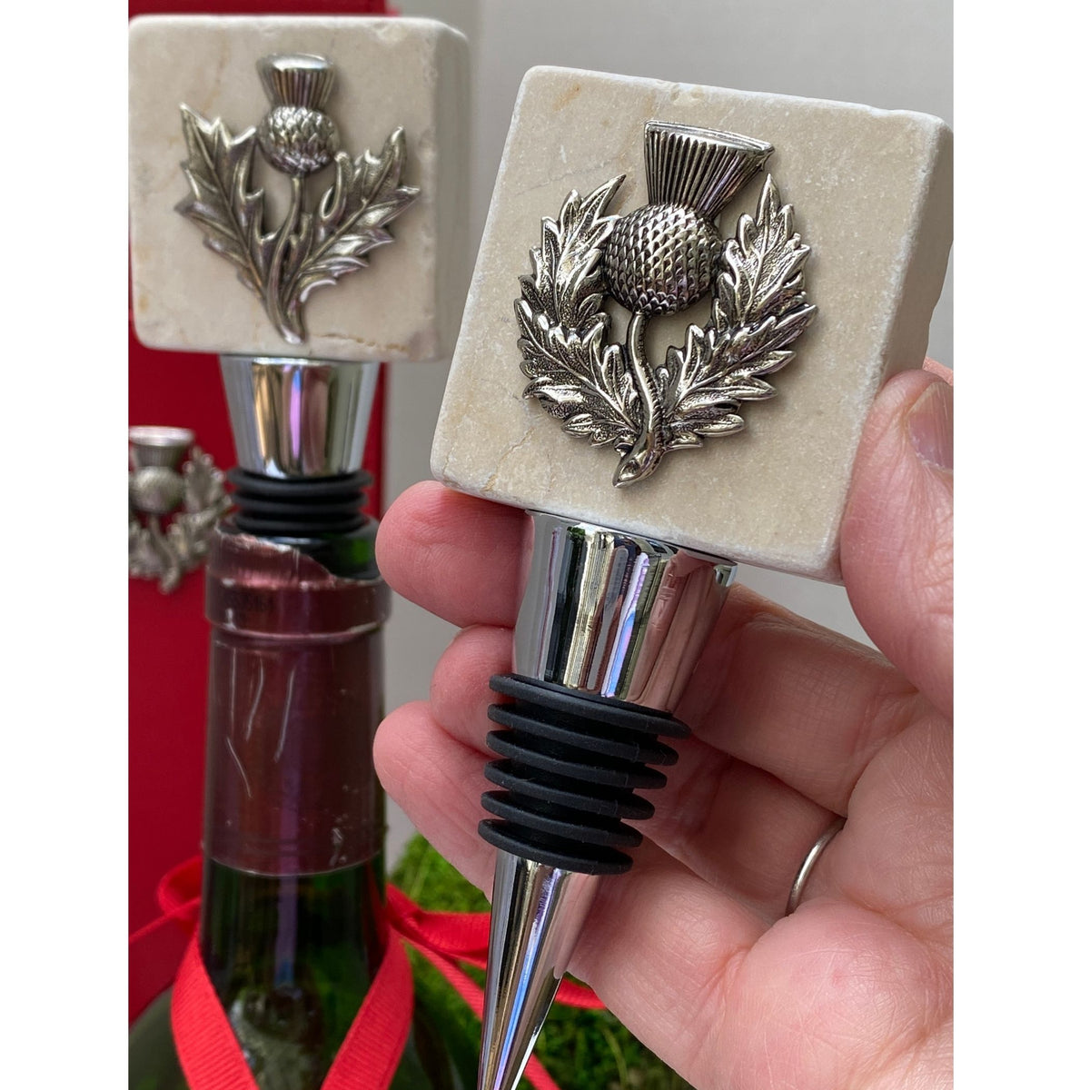 Holding the Marble Bottle stopper with the Silver thistle