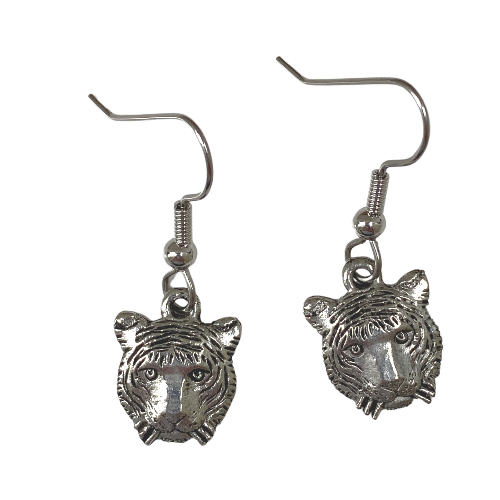 A pair of silver earrings shaped like tiger faces, with French ear wires.