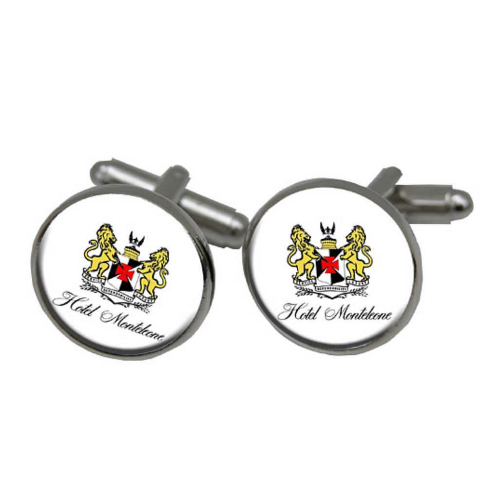 A pair of custom round cufflinks with a silver plate setting, featuring the logo or art image of the client.